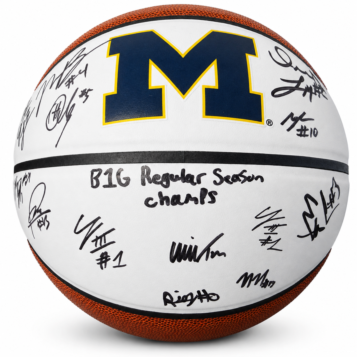A Michigan basketball signed by multiple players, featuring the navy and maize 'M' logo on a white surface with black signatures and 'BIG Regular Season champs' written in the center.